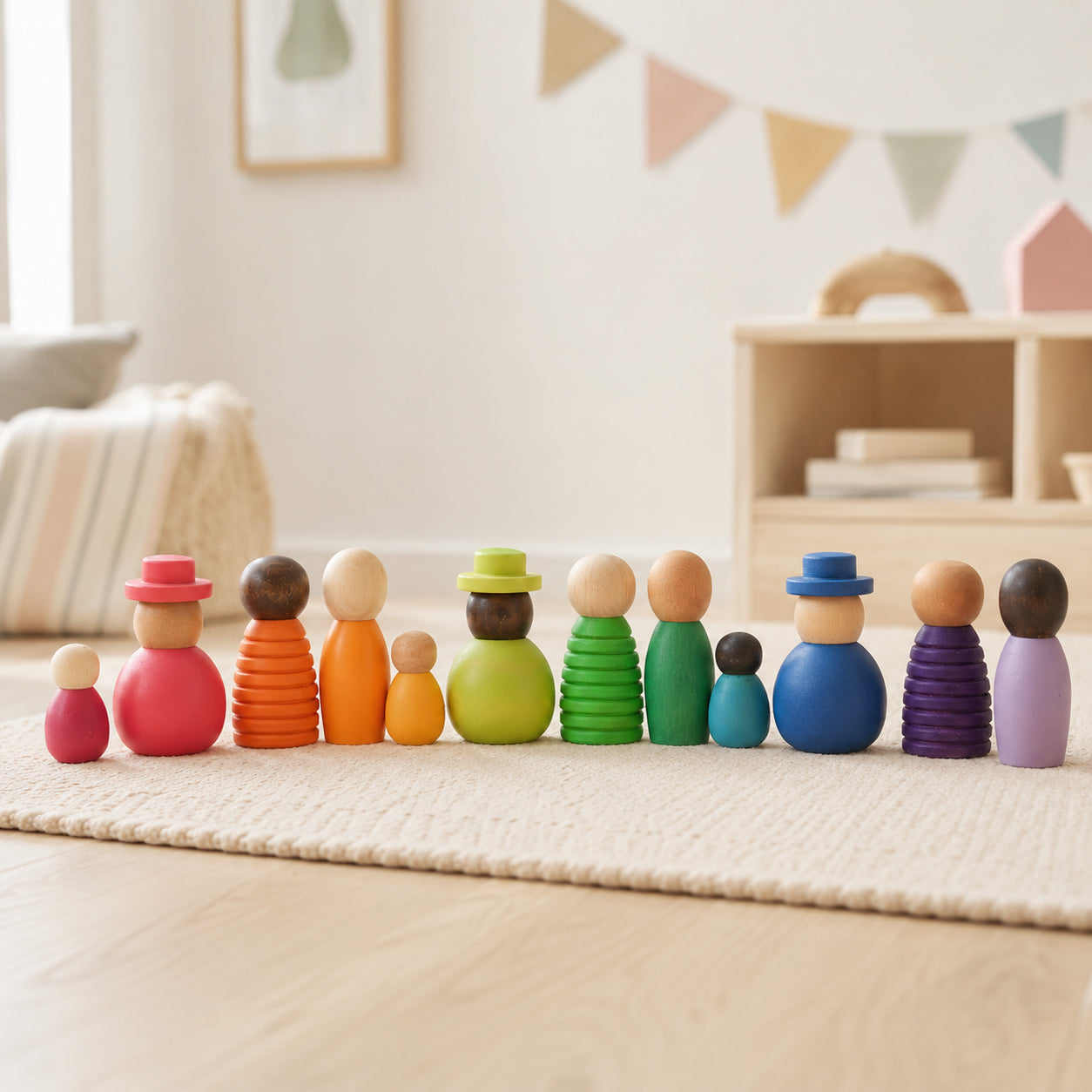 Hicooo 12-piece diverse wooden peg dolls in multicolor, arranged on a nursery rug for open-ended pretend play.