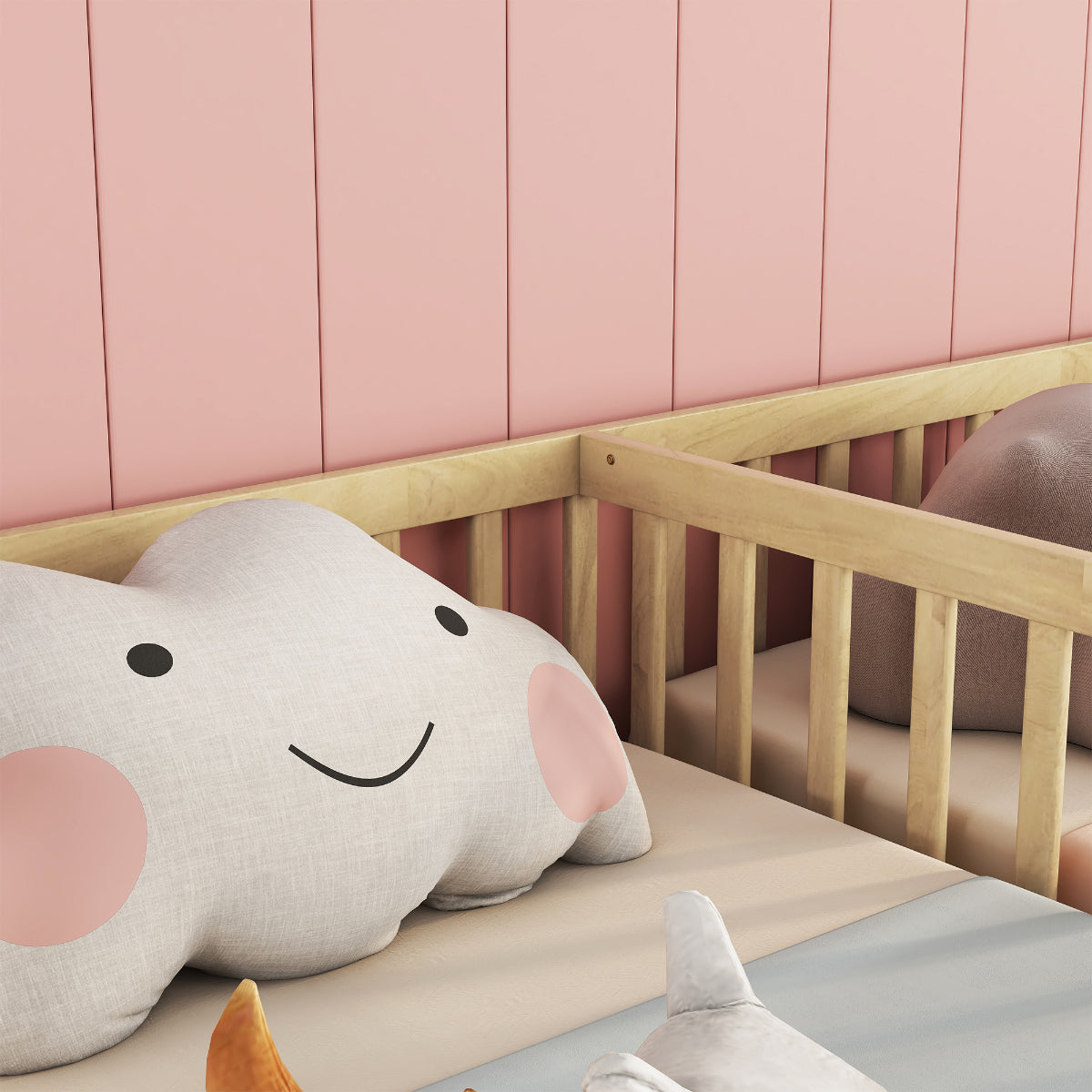 Children's room with a crib and plush elephant toy against a pink wall.