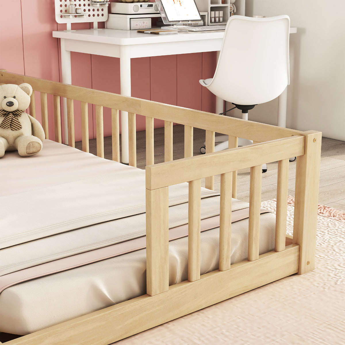 Wooden bed rail in a bedroom setting with a teddy bear and desk in the background.