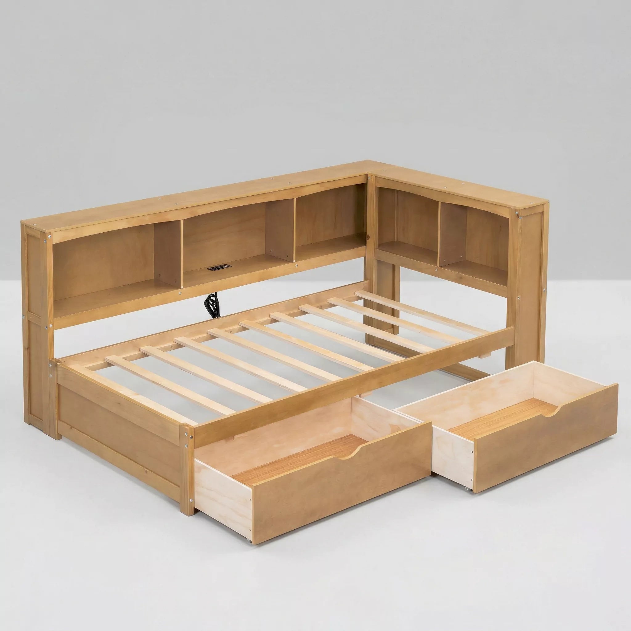 A direct side view photograph of the modern fully assembled wooden full-size platform bed frame, made from white panels and natural pine wood, presenting a clean profile with all storage drawers and shelves closed, against a plain white studio background.