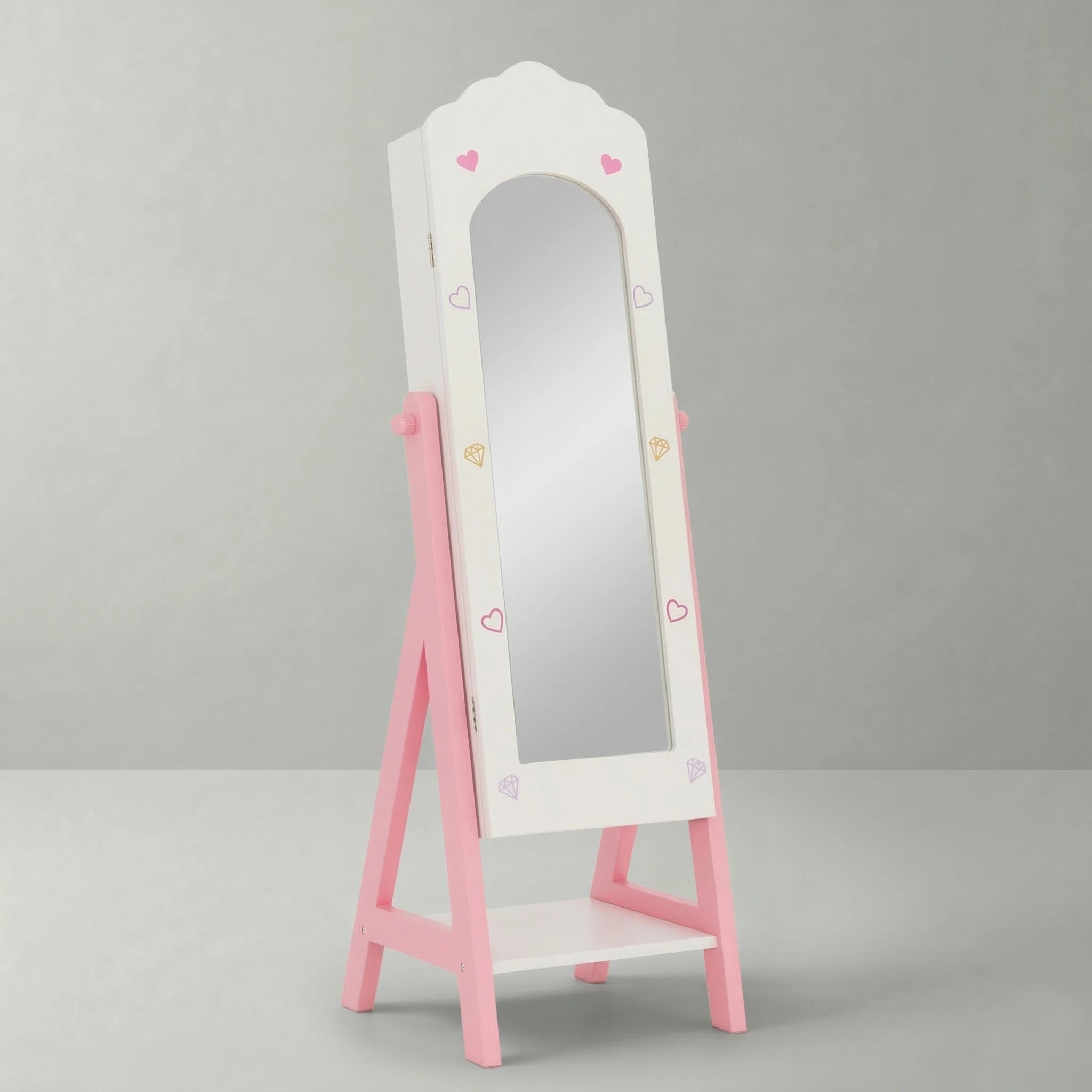A freestanding kids full-length mirror and jewelry cabinet by Hicooo in pink and white, with the door closed revealing a clear mirror and cute heart and diamond patterns on the frame.