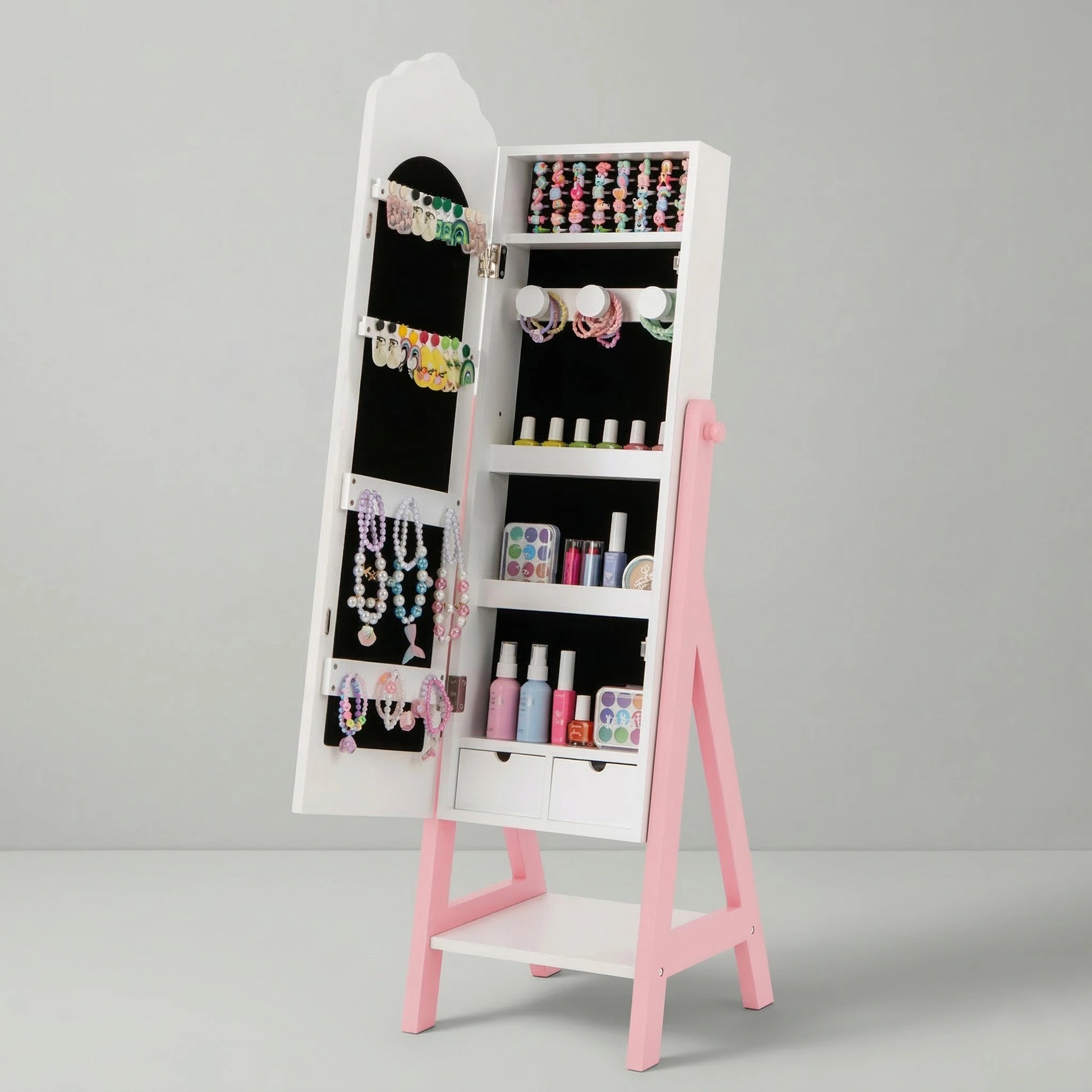 An open Hicooo pink and white kids jewelry cabinet showing a black velvet interior with neatly organized earrings, bracelets, necklaces, makeup shelves, and two small drawers.