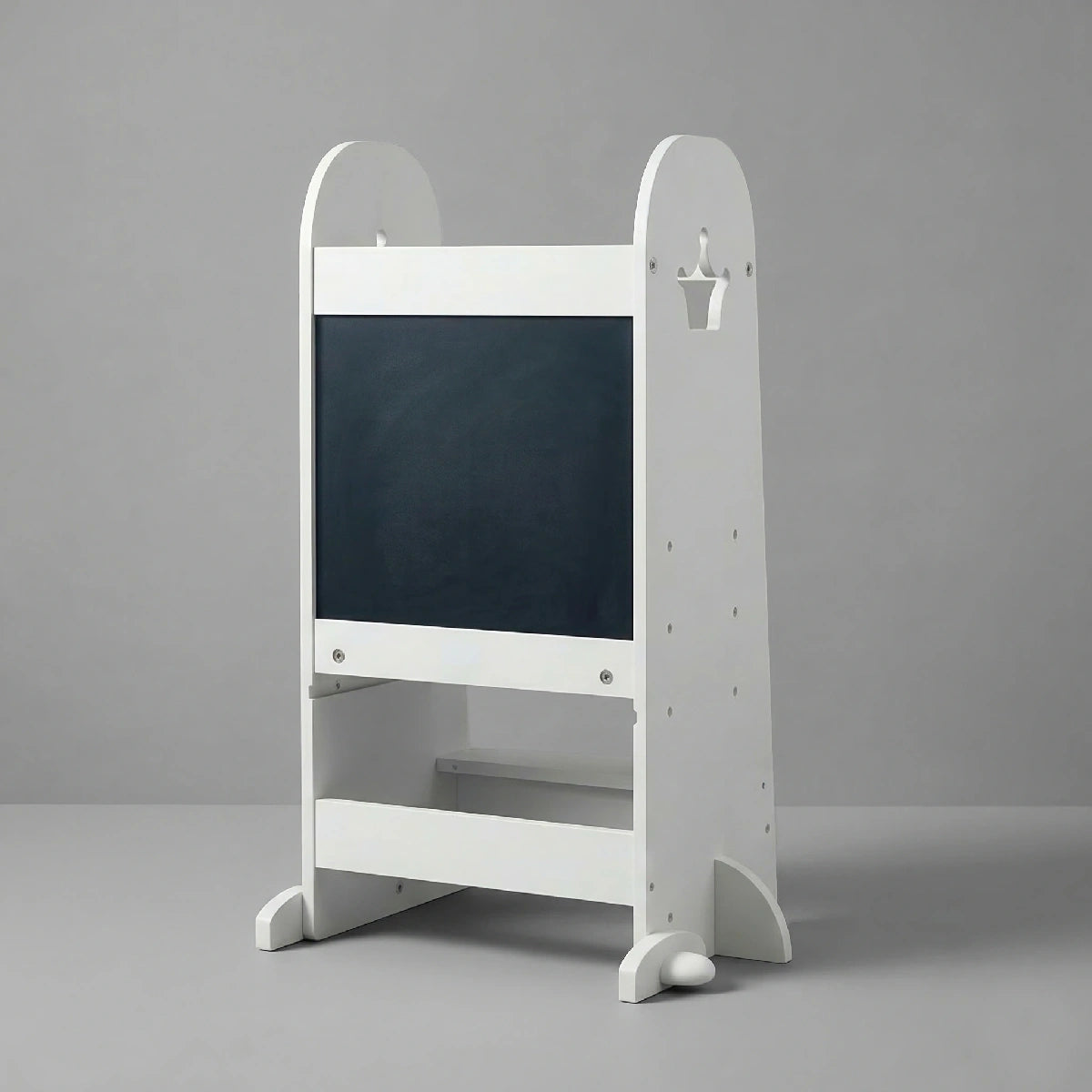 The Hicooo white wooden toddler learning tower showing its back panel, which features a large black chalkboard surface, standing on a light grey background.