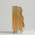 Side profile view of a Hicooo wooden kids' bookshelf, showcasing its space-saving depth, wavy edge detailing, and sturdy raised legs.
