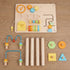 Flat lay view of the hicooo wooden Montessori activity table components. Includes the main activity board with clock and gears, four solid wood legs, two wire bead maze attachments, and geometric shape blocks.