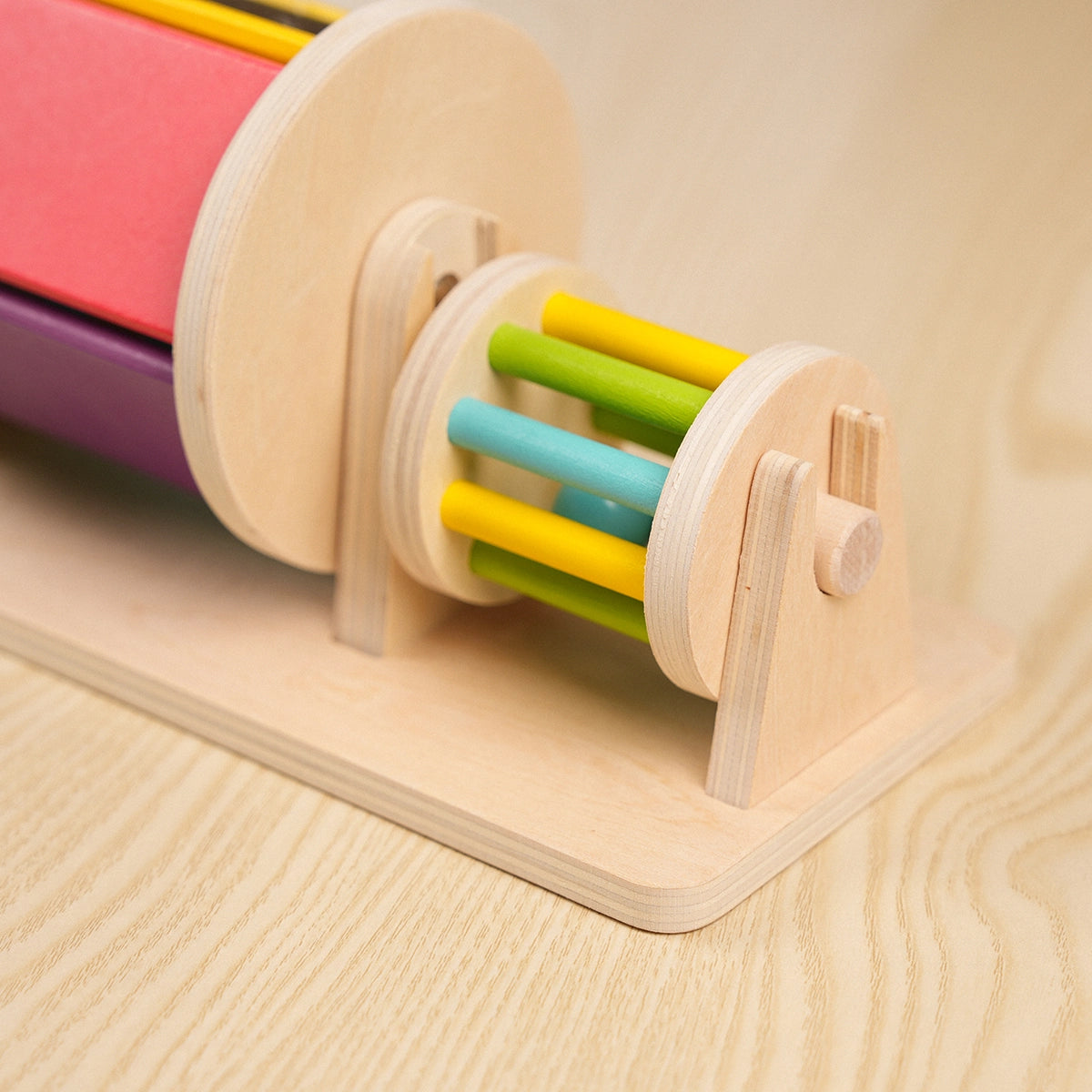hicooo wooden roller toy - side angle view showing colorful bars and smooth natural wood frame