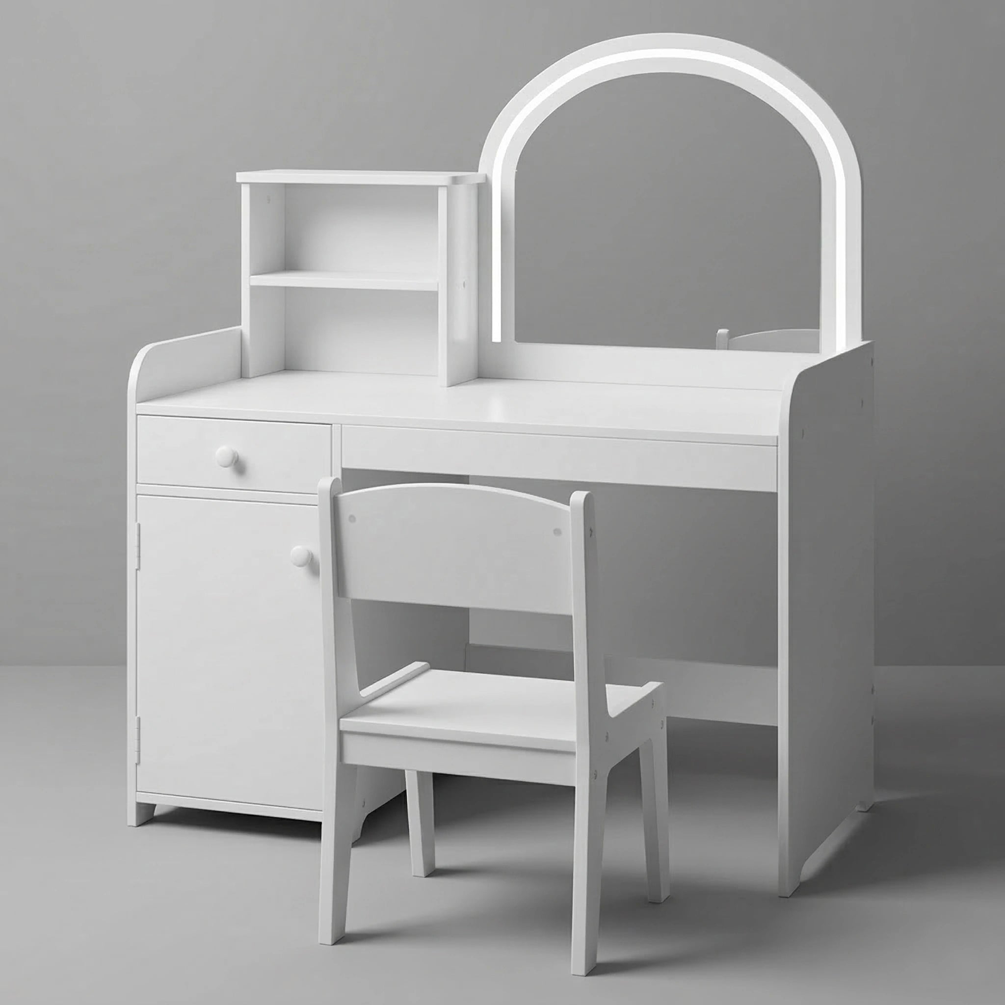 A lovely children's room setup displaying a white wooden kids vanity table with a matching chair. The arched mirror has built-in LED lights. The vanity includes a side bookshelf filled with books, a drawer, and storage shelves. A cute knitted alpaca toy is on the floor.