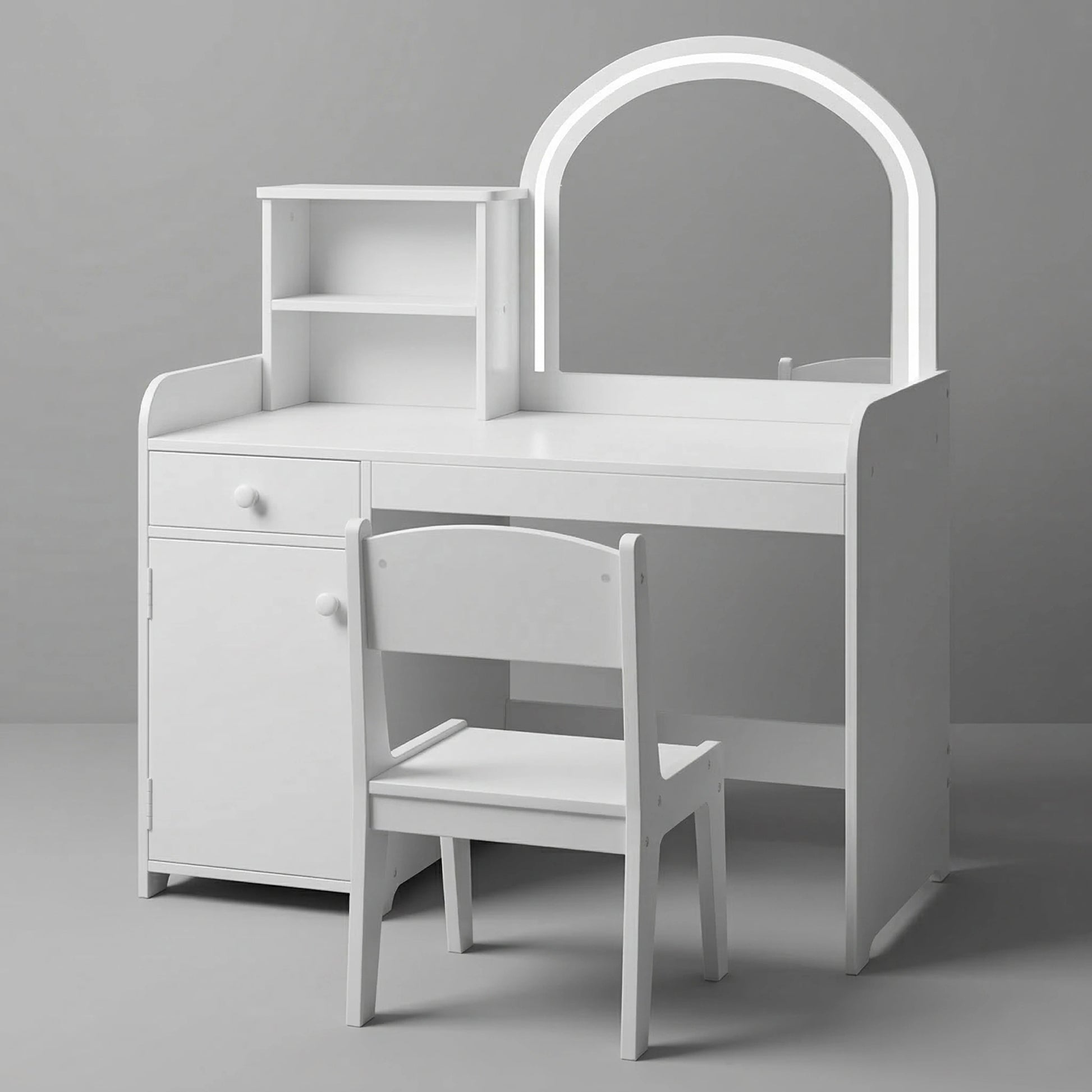 A lovely children's room setup displaying a white wooden kids vanity table with a matching chair. The arched mirror has built-in LED lights. The vanity includes a side bookshelf filled with books, a drawer, and storage shelves. A cute knitted alpaca toy is on the floor.