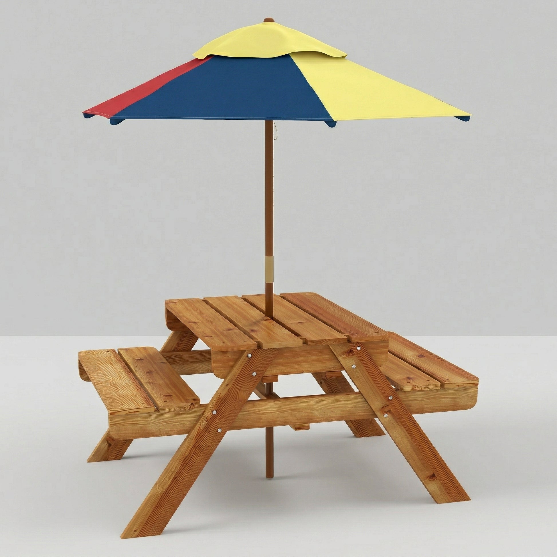 A studio product shot of a wooden kids' picnic table featuring an A-frame design, attached seating benches, and a bright red, blue, and yellow sun umbrella, set against a plain white background.