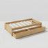 A studio photograph on a white background, featuring a clean, white-painted wooden twin-size platform bed frame. It displays a slat support system, a low headboard with simple vertical planks, a matching footboard, and two built-in pull-out storage drawers on wheels.