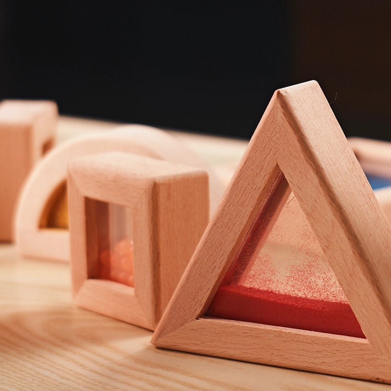 Macro shot of interconnected wooden rainbow blocks showing the transparency and high-quality beechwood frames.