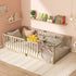 Wooden crib with bedding and toys in a child's room with shelves and decor.