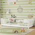 Children's room with a white crib, colorful toys, and cartoon animal wallpaper.