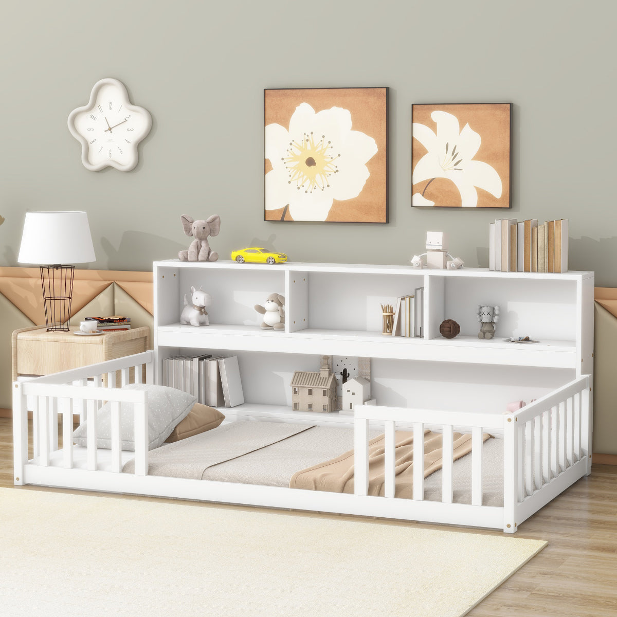 White children's bed with bookshelves in a room with floral wall art and a clock.