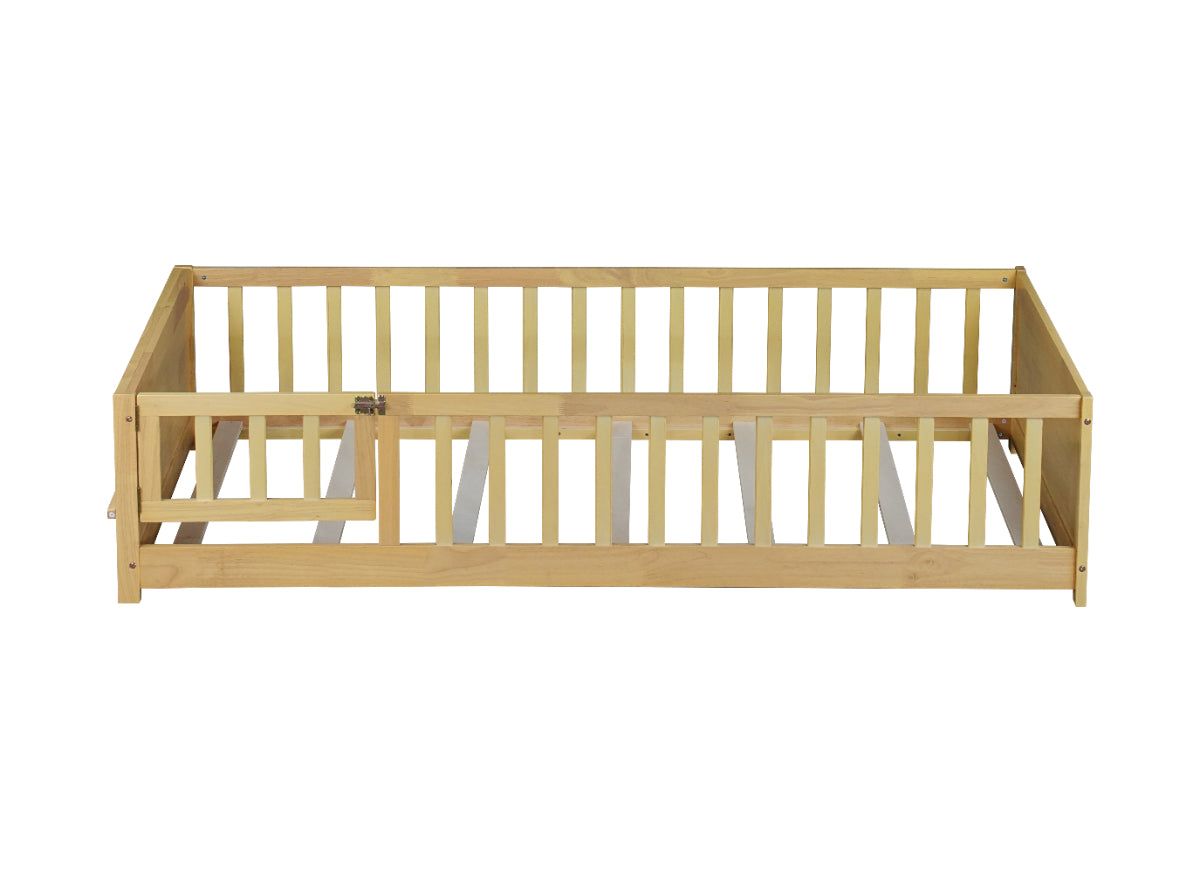 A light natural wood toddler bed guard rail with a matching gate, shown from a front-three-quarters angle on a solid white background.
