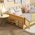 Wooden children's bed with books and pillows in a room setting