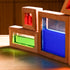Detail shot of a triangle-shaped wooden sensory block stacked on rectangular light-filtering blocks.